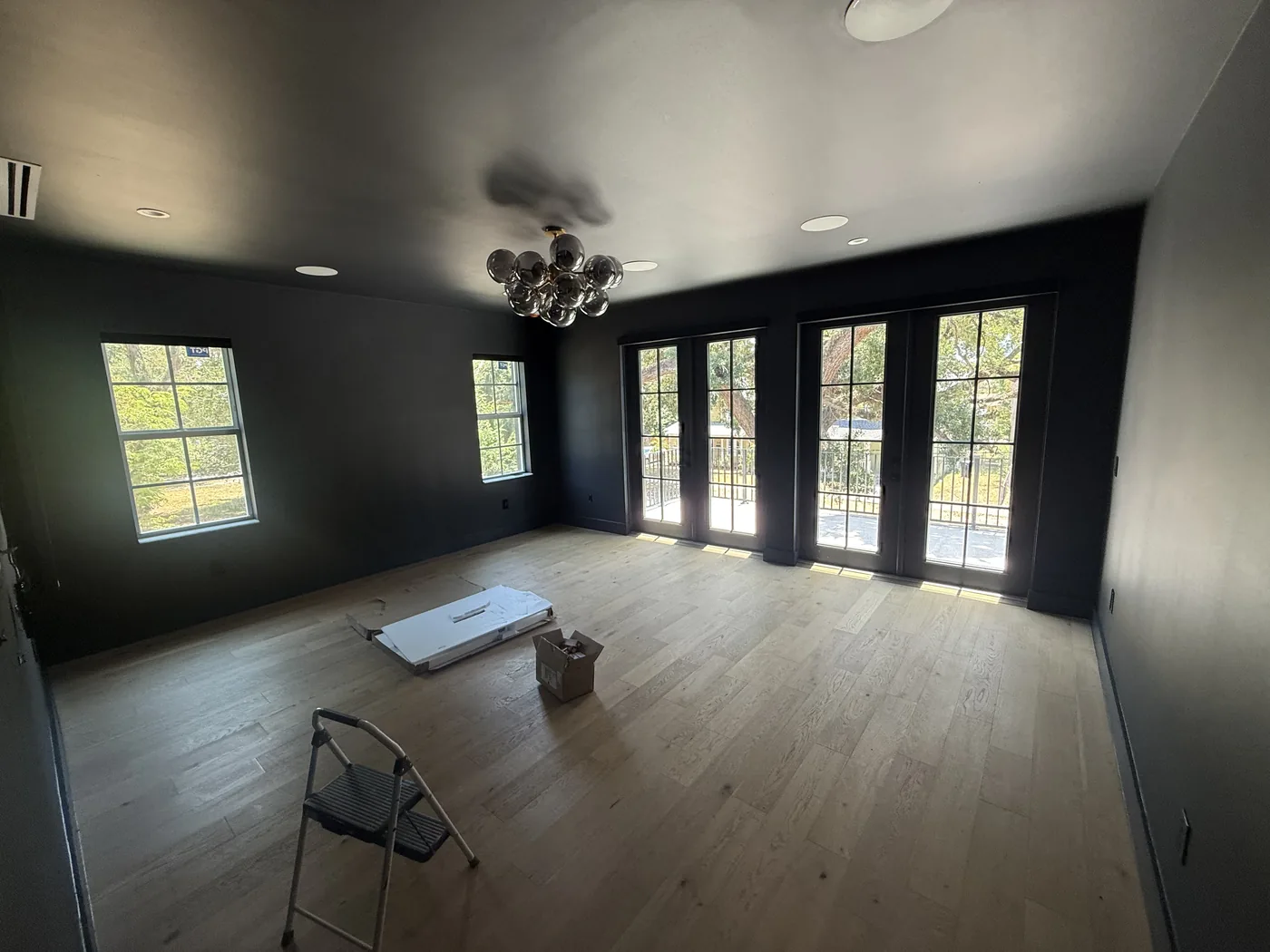 Interior room painted in a deep charcoal with the trim cut in clean